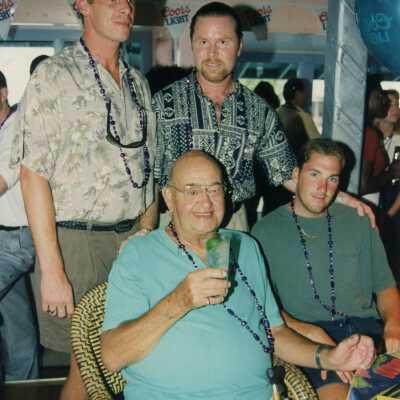 Four unknown men at a ceremony.