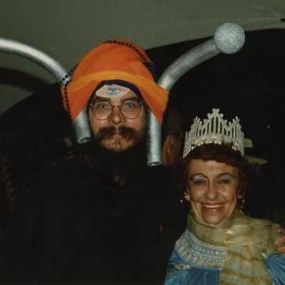 Two unknown people dressed up.