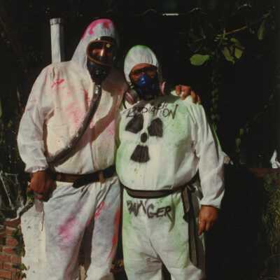 Two unknown people dressed up.