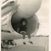 A U.S. navy jet with a child sitting inside