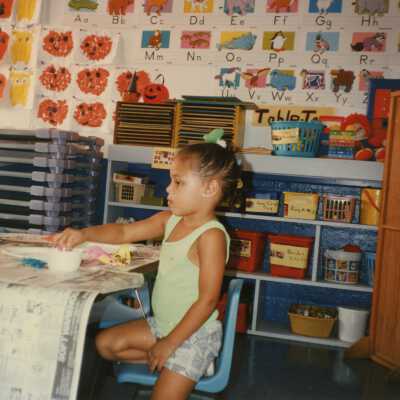An unknown child in a classroom.