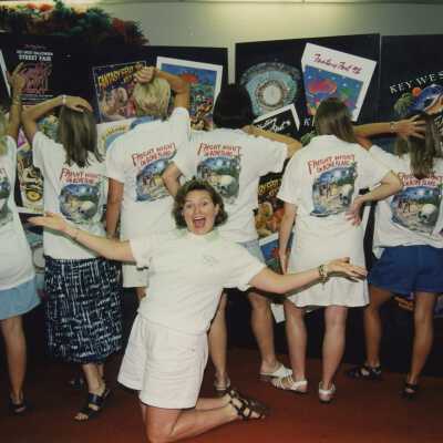 Unknown woman showing off the back of FF shirts.