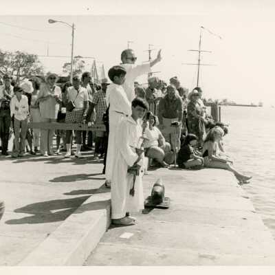 A ceremony near the pier facing the water