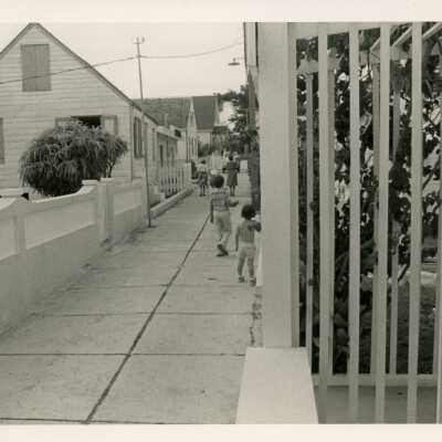 Children walking down a side walk