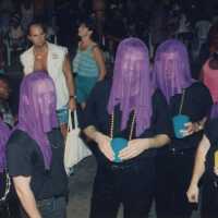 A group of unknown people dressed up.