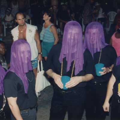 A group of unknown people dressed up.