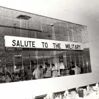 A sign reading "Salute to the Military"