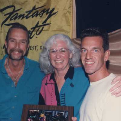 Unknown people accepting an award at the award ceremony.