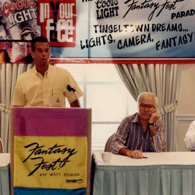 Unknown man speaking at the Fantasy Fest meeting.