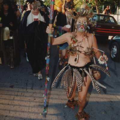 Unknown people walking in the Masquerade parade.