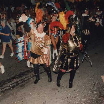 Unknown people walking in the parade.