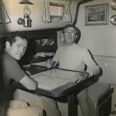 Unknown men looking at a map