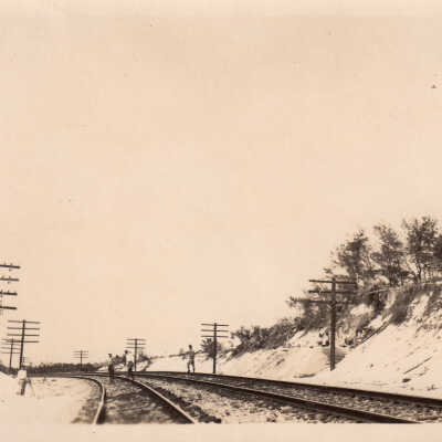 Men on railroad tracks