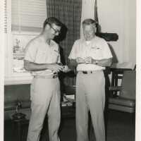 2 Men in uniform in an office