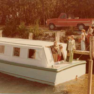 Unknown people getting on a boat