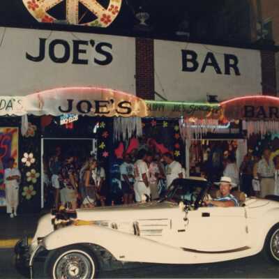 An old car in front of Sloppy Joe's Bar.