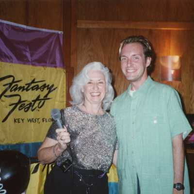 An unknown woman and man at an award ceremony.
