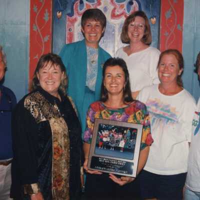Unknown people with a plaque.