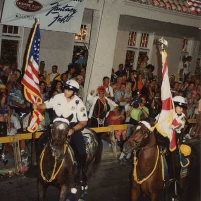 Cops opening the parade on horses.