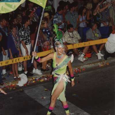 Unknown woman dressed up walking in the parade.