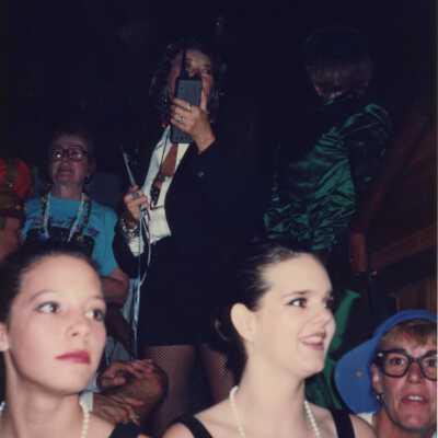 Unknown woman talking into a walkie-talkie.