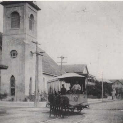 Mule-drawn streetcar near the Old Stone Methodist Church