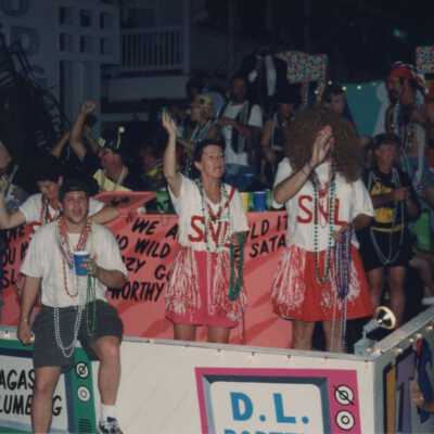 Unknown people dressed up on a float.
