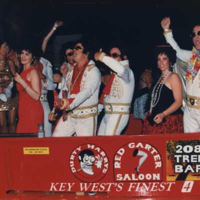 Unknown people dressed up on the Rick's complex float.