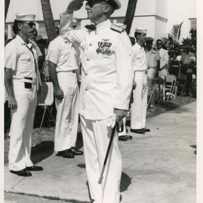 Unknown man in uniform saluting