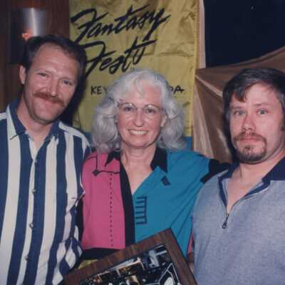 Unknown people accepting an award at the award ceremony.