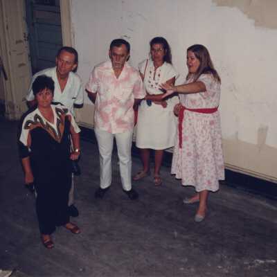 A group of unknown people standing inside.