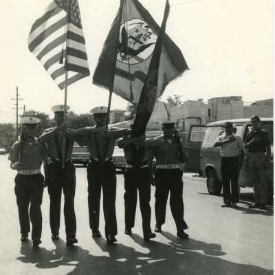 Men in uniform with the flag
