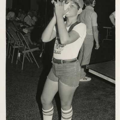 A child blowing a conch