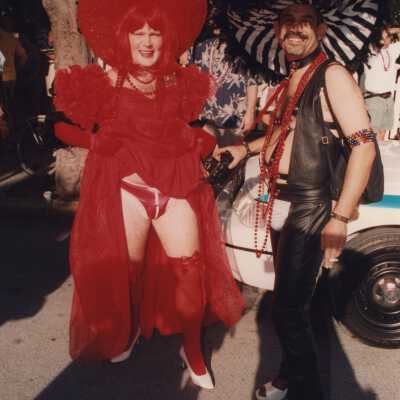 Two unknown people dressed up.