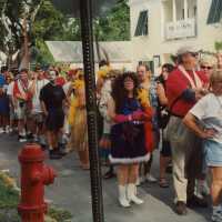 A group of unknown people waiting in a line.