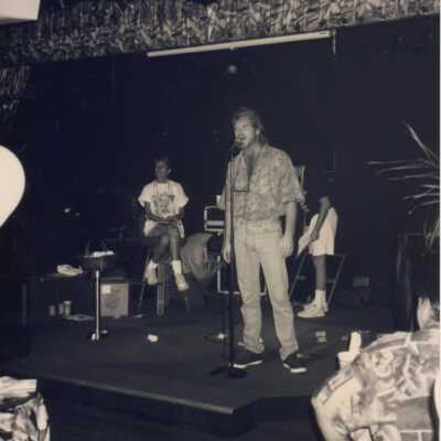 Unknown man on stage talking.