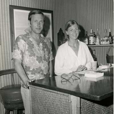 Unknown couple standing at a bar