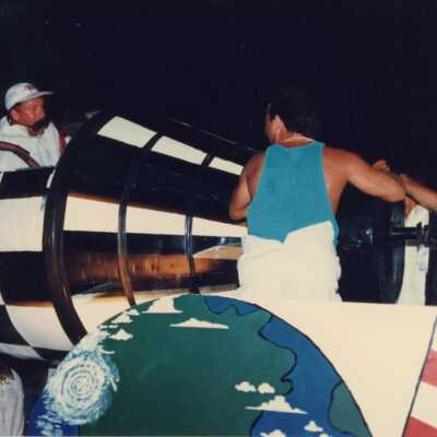 Unknown people on a float talking to each other.