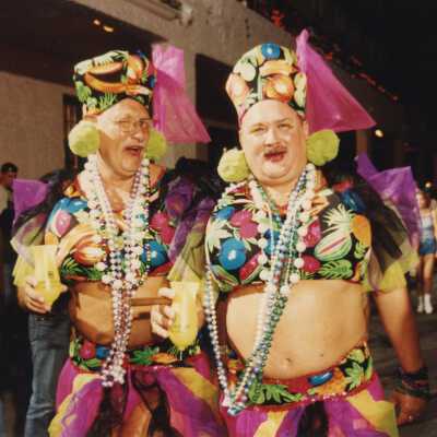 Two unknown men dressed up.