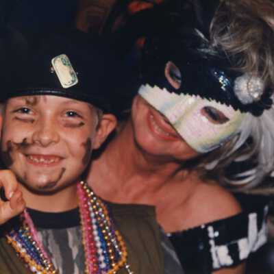 Unknown woman and a child dressed up.