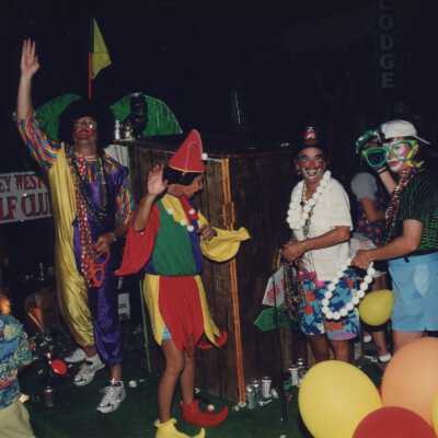 Unknown people dressed up on a float in the parade.