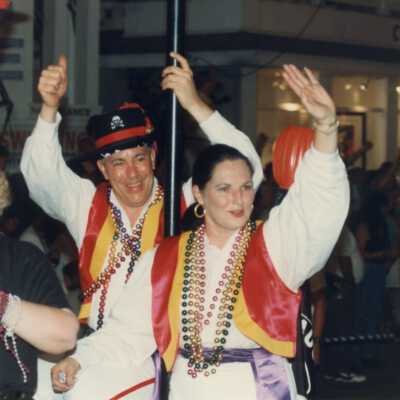 Unknown people dressed up on a float.