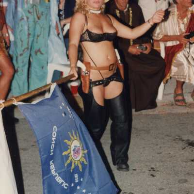 An unknown woman dressed up holding a Conch Republic.