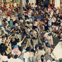 A group of people in the street during the parade.