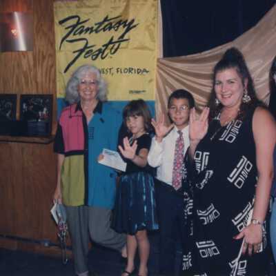 Unknown people accepting an award at the award ceremony.