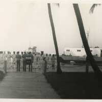 A group of people in uniform near the pier