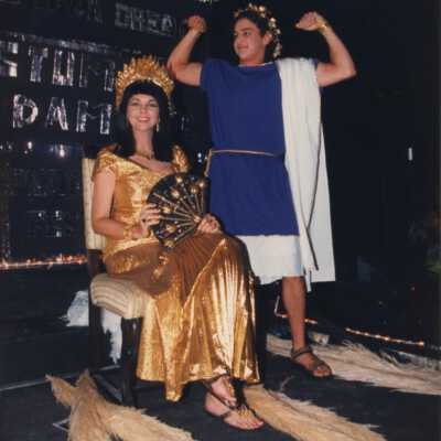 Unknown people dressed up on a float in the parade.