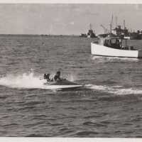          Man in a speedboat
   