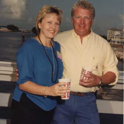 Unknown couple standing near the water.