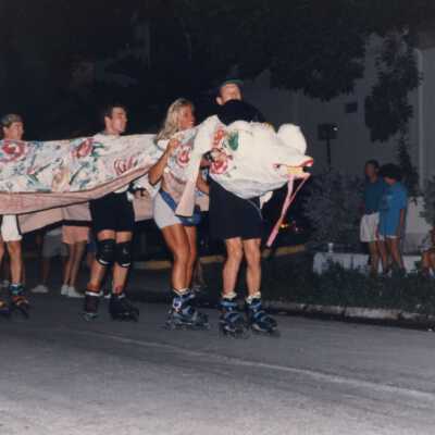 Unknown people roller blading during the parade.